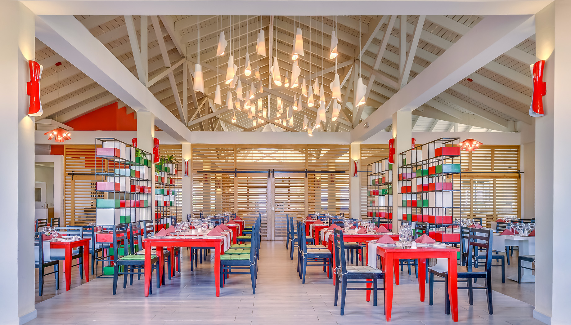 a restaurant with colorful tables and chairs