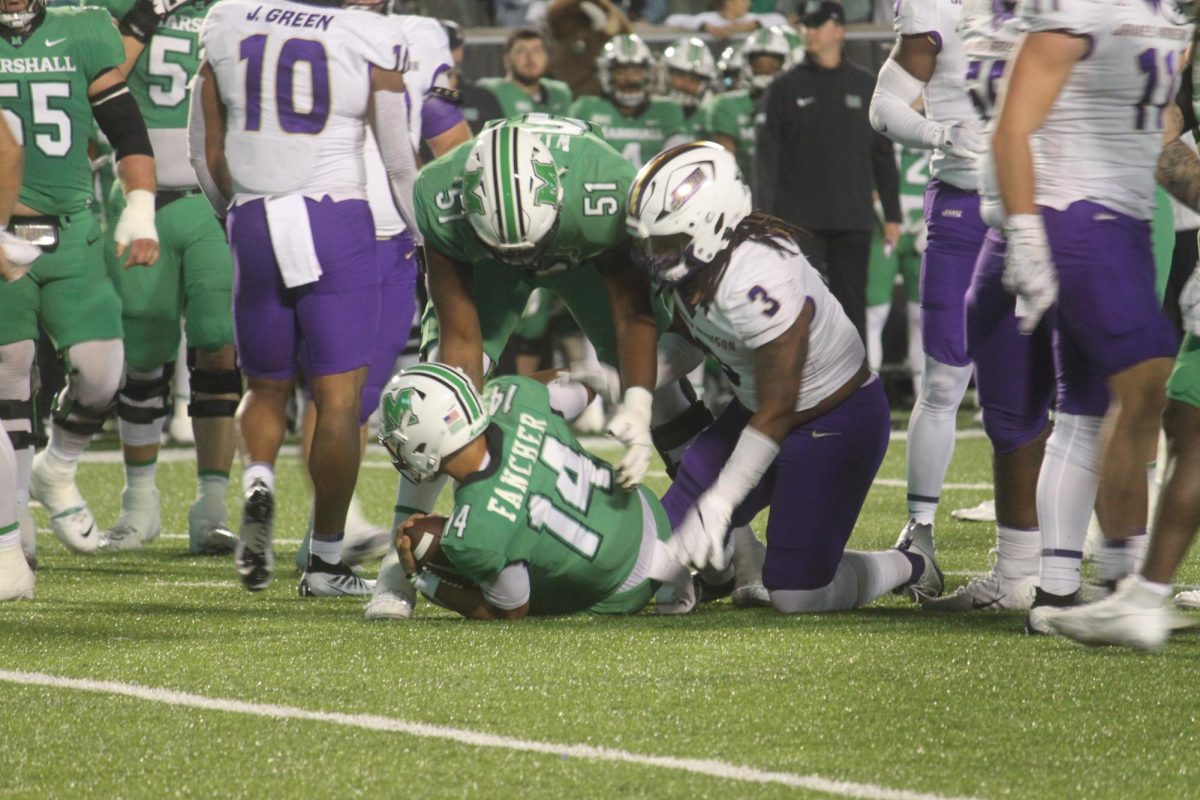 Cam Fancher is tackled by a JMU defender.