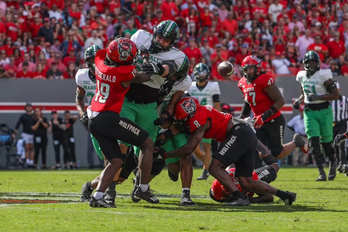 Marshall players battle with the Wolfpack.