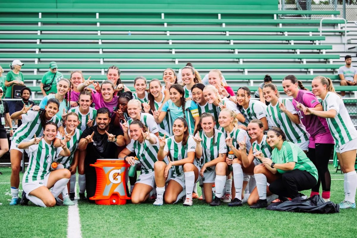 Simoes celebrates with his team following their win.