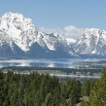 snow covered mountains and lake