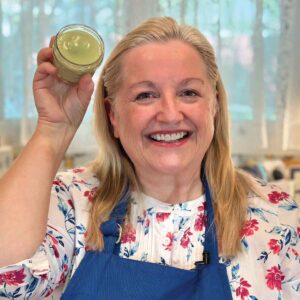 Mary holding a Homemade Natural Antibiotic Ointment.