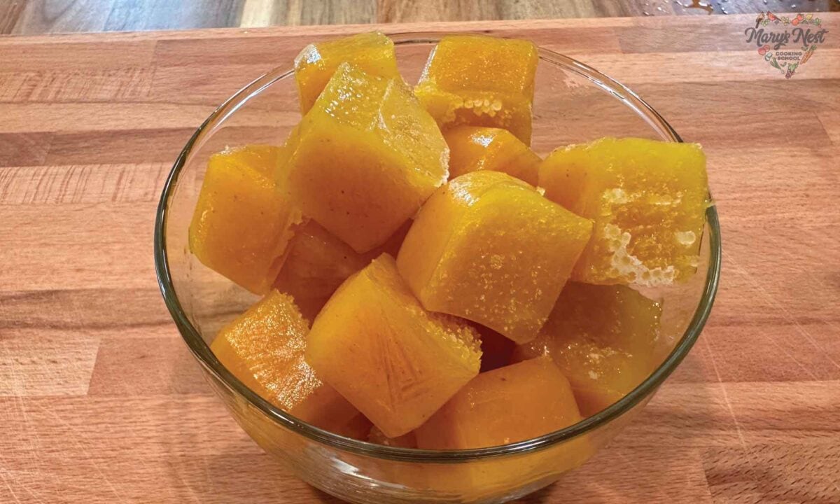 Turmeric Tea Ice Cubes in a glass cup.