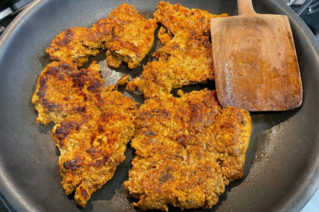 cooking chicken chorizo in a skillet