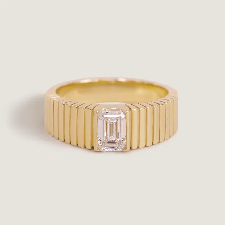 Gold ribbed emerald diamond Taylor Swift inspired engagement ring from Kinn