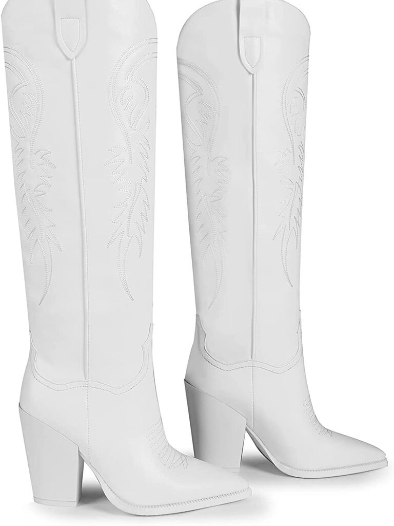 Knee-high white cowboy boots. 