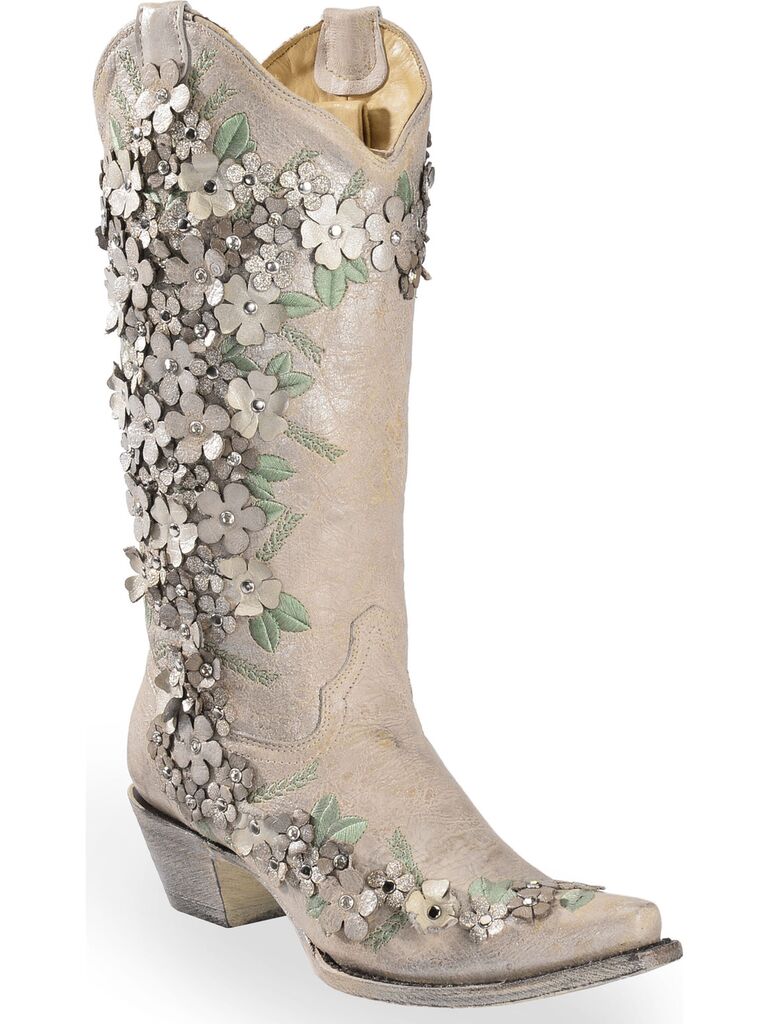 Beautiful cowboy boots with a textured floral pattern. 