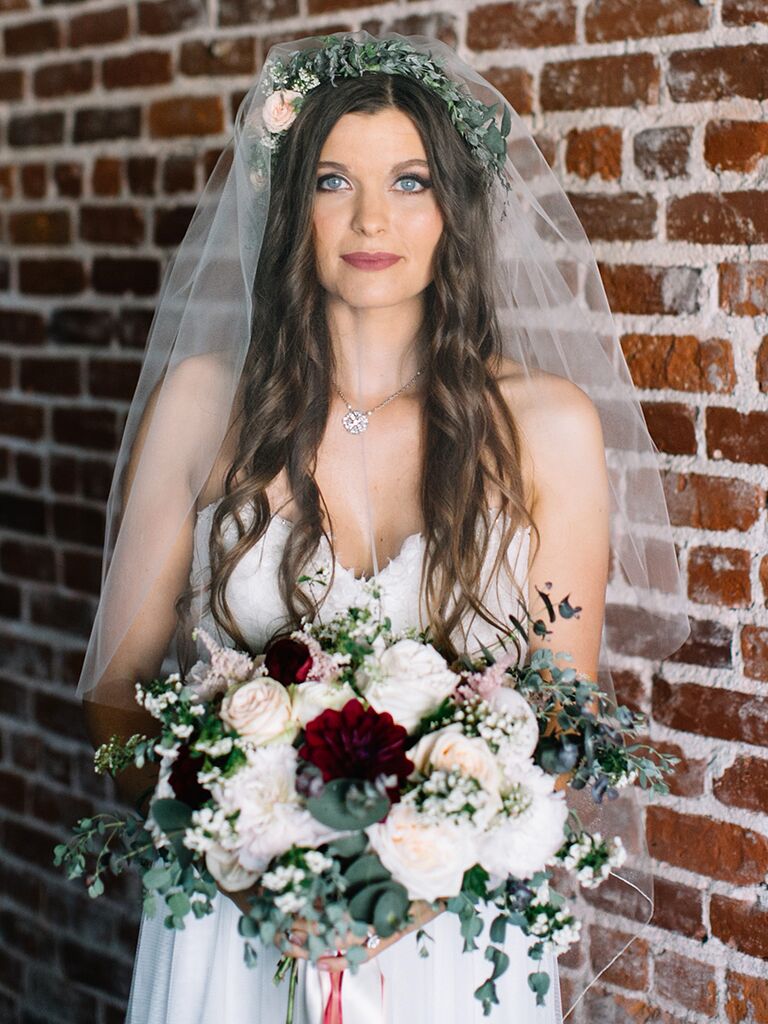 Boho hairstyle and flower crown with a simple veil