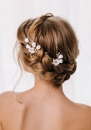 braided bridal hairstyle with white flower hair picks