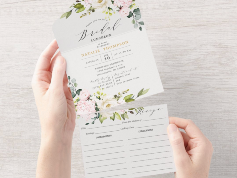 Woman holding floral bridal shower recipe card