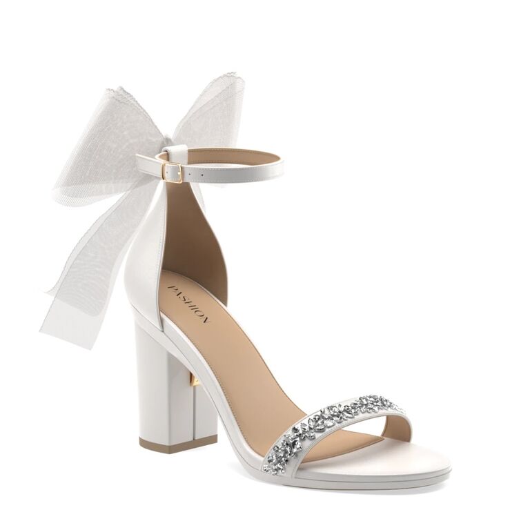 White block heels with a bow by Pashion. 