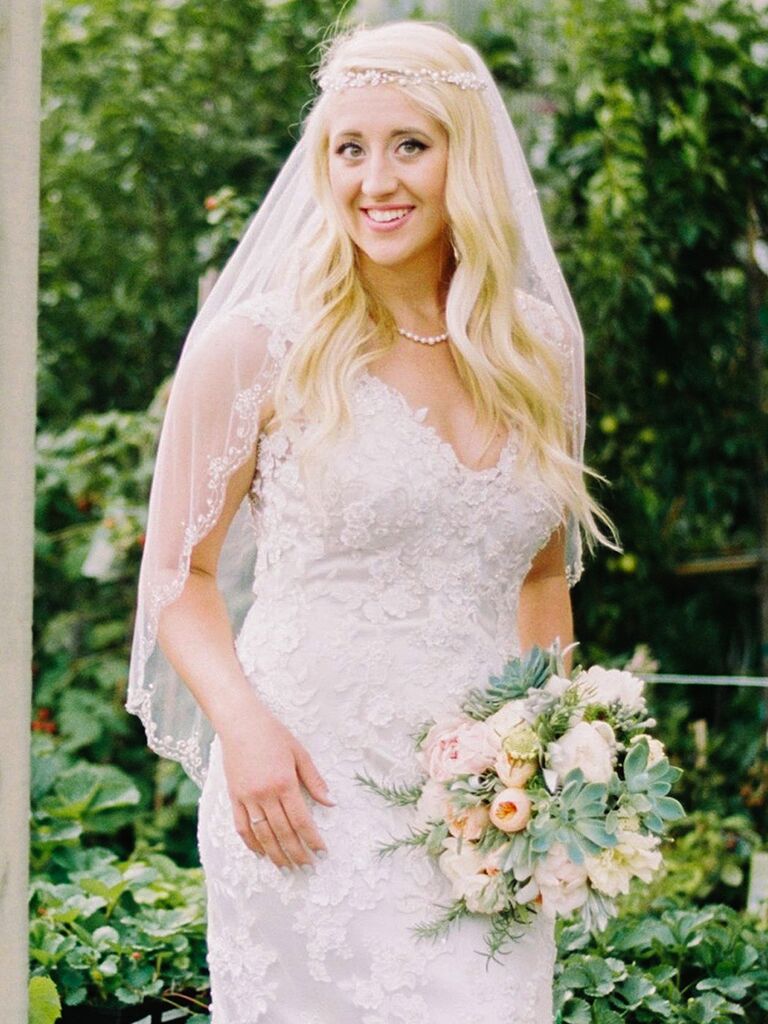 Gold halo crown with embellished flowers and an elbow-length veil