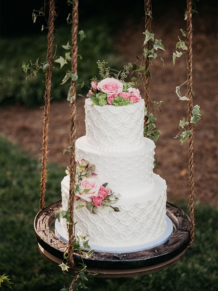 Buttercream spring wedding cake with pink roses