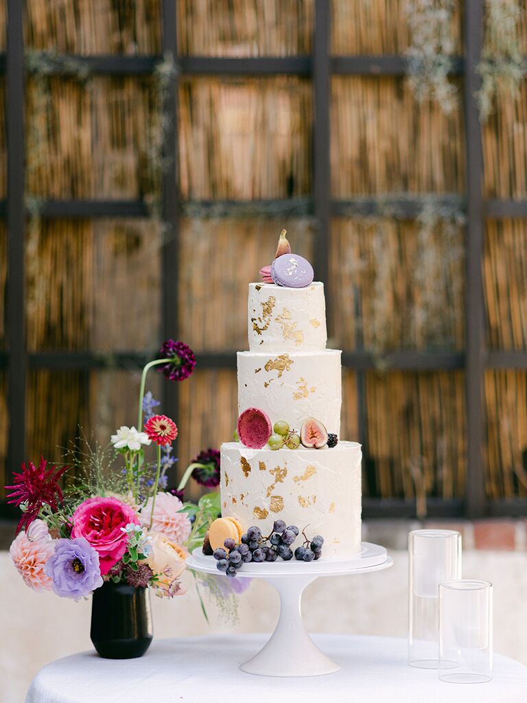 Spring wedding cake with fresh fruit and macarons