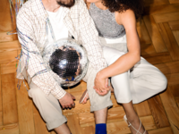 Couple holding disco ball and kissing on New Year's, Couples New Year's resolutions