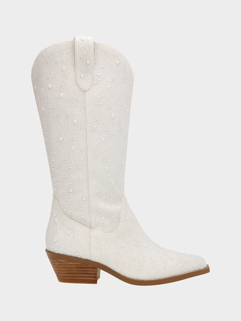 White cowboy boots with a block heel by Betsey Johnson. 