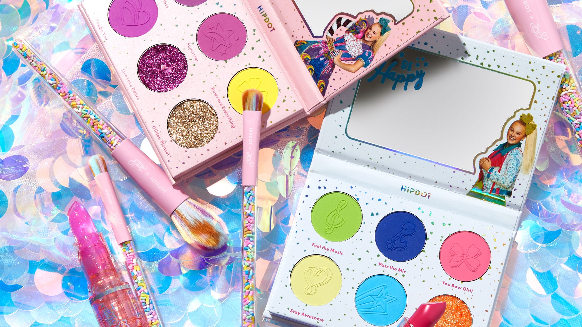 HipDot x JoJo Siwa makeup collection on colorful background