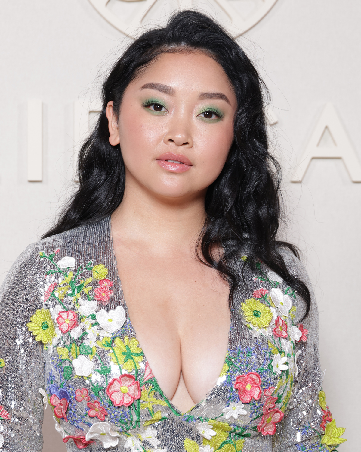 Lana Condor in wavy black hair with side part