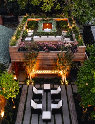 Image may contain Outdoors Furniture Chair Garden Vase Potted Plant Plant Pottery Jar Arbour Hotel and Building