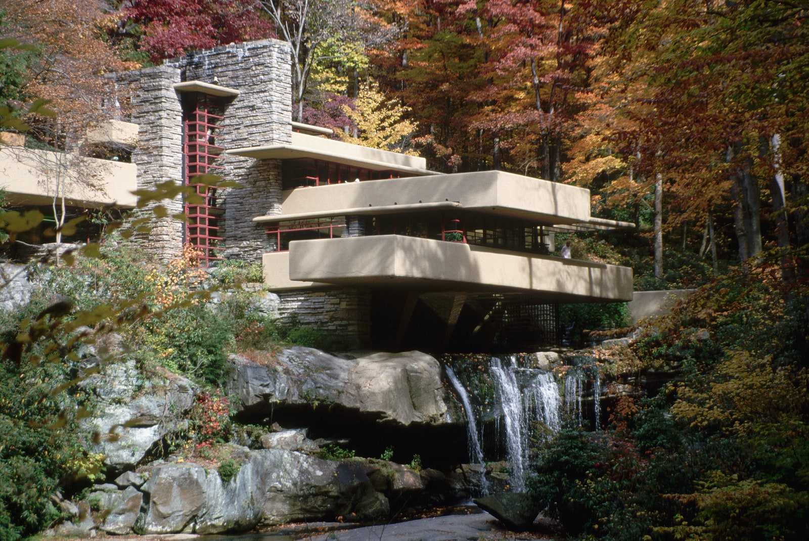 modern building built into a waterfall