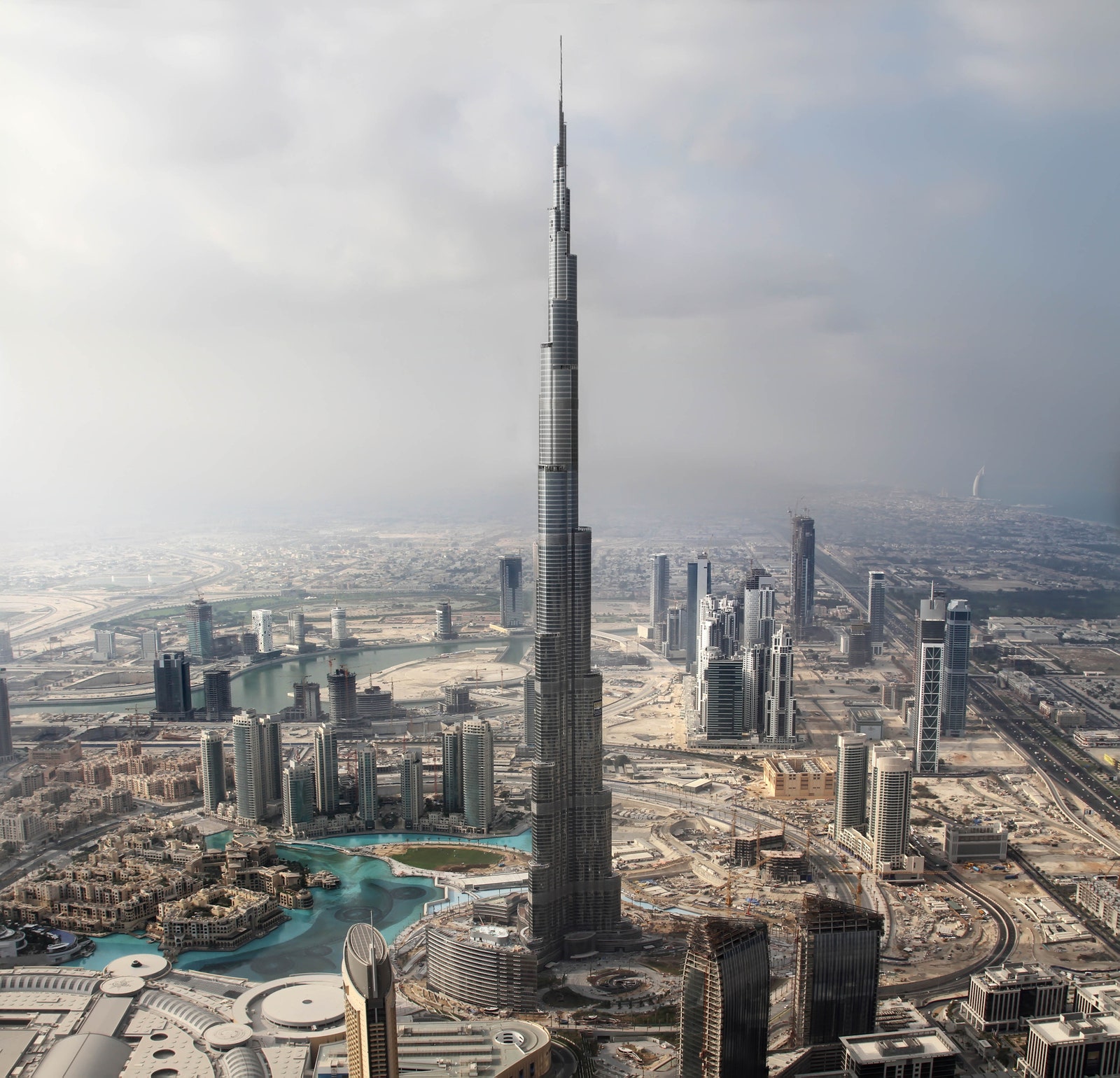 tall building surrounded by smaller buildings