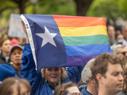 AUSTIN, TX - MARCH 20: Supporters of trans rights rally on the steps of the Texas Capitol