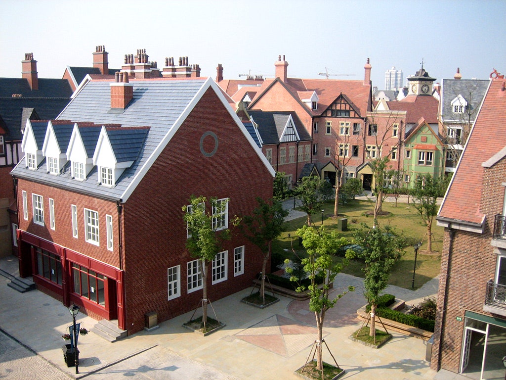 This image may contain Roof Urban City Town Building Downtown Neighborhood and Architecture