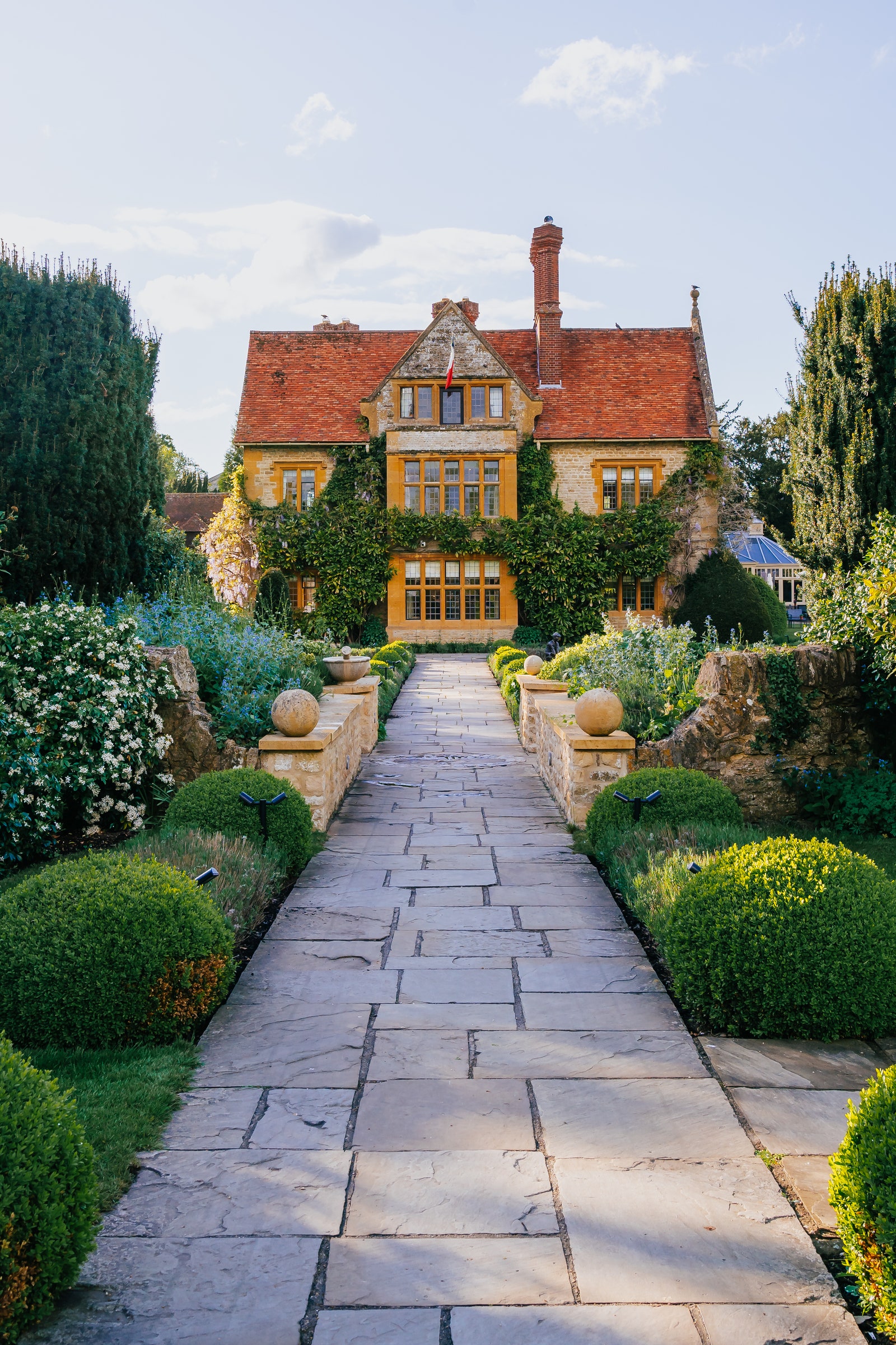 Image may contain Architecture Building Housing House Outdoors Manor and Plant