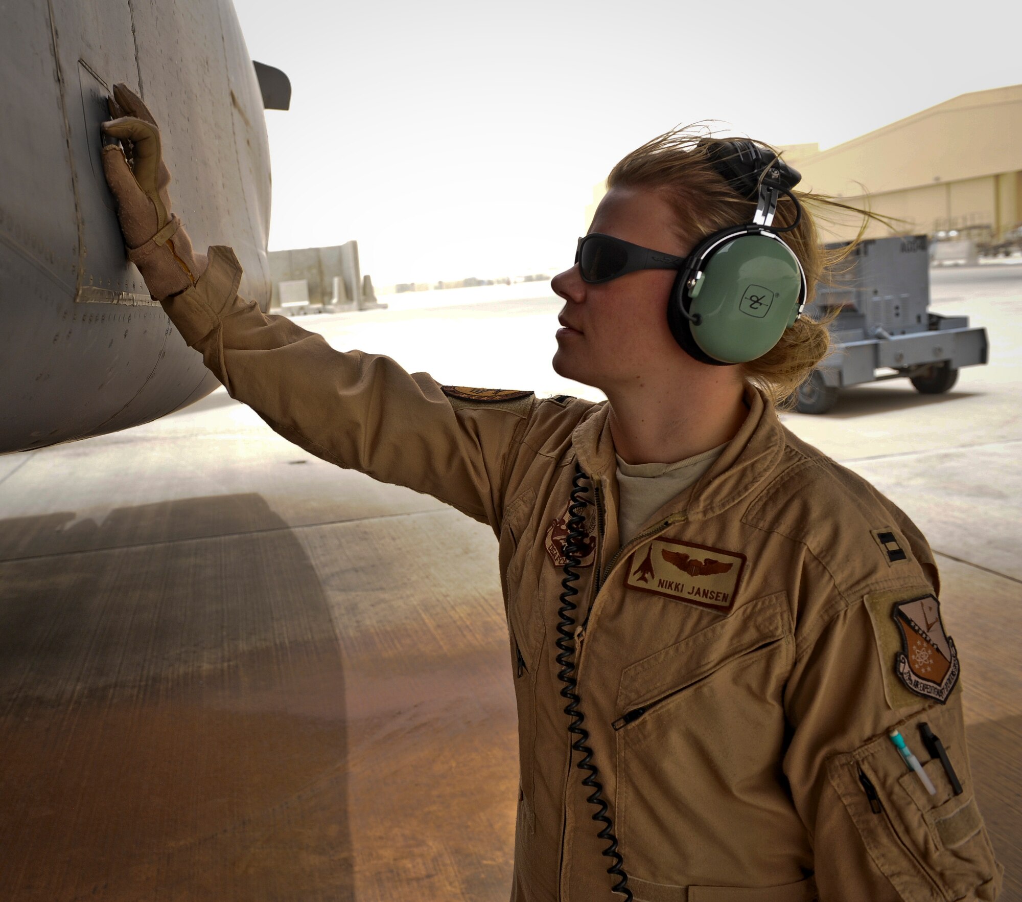 Capt. Nikki Jansen performs pre-flight checks of a B-1B Lancer June 11, 2013, at the 379th Air Expeditionary Wing in Southwest Asia. Jansen is a 34th Expeditionary Bomb Squadron pilot deployed from Ellsworth Air Force Base, S.D. (U.S. Air Force photo/Senior Airman Benjamin Stratton)