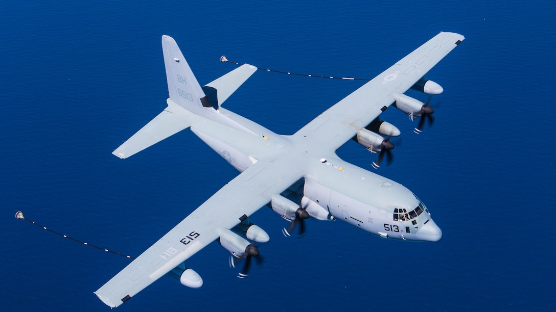 Refueling lines extend from the wings of a U.S. Marine KC-130J from Special-Purpose Marine Air-Ground Task Force Crisis Response-Africa off the coast of Spain May 15, 2015. The aircraft completed aerial-refueling operations with Spanish Navy Harriers to test the unit’s ability to work with Spanish aircraft from its base of operations at Morón Air Base, Spain. 