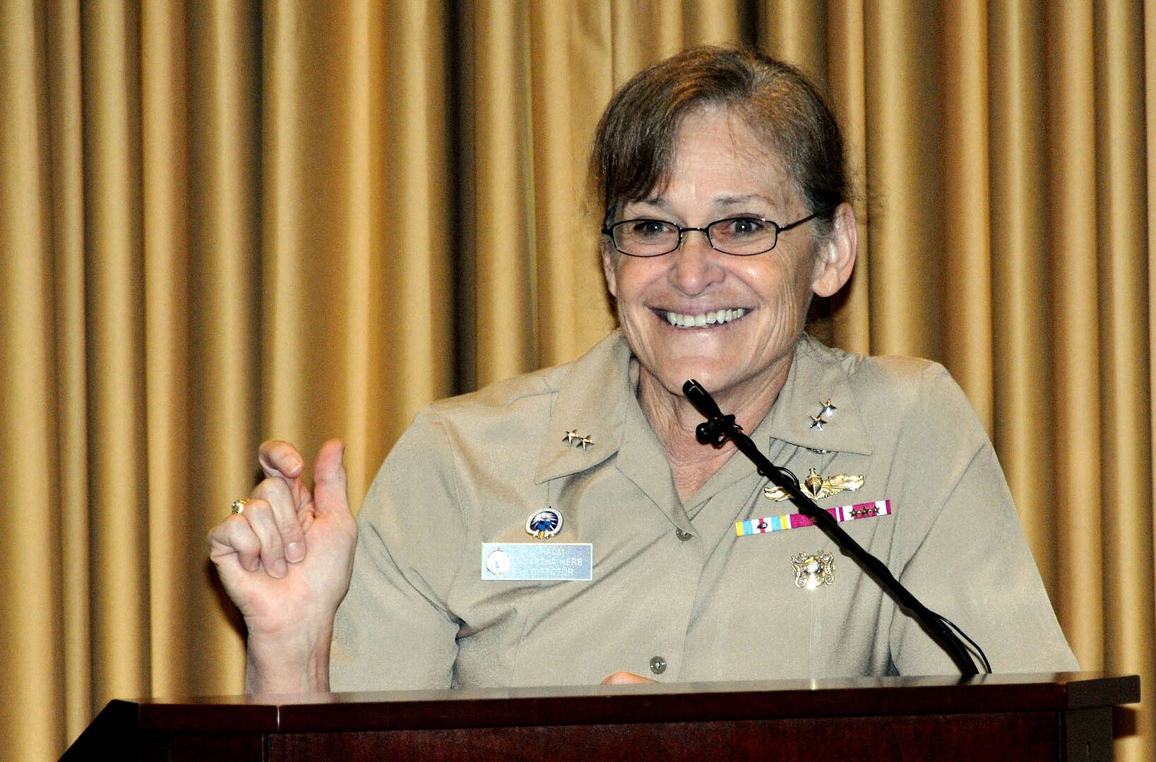 Navy Rear Adm. Martha Herb, director of the Inter-American Defense College, describes how she has fully embraced the vitality and legacy of the Hispanic culture during an event commemorating Hispanic Heritage Month at the McNamara Headquarters Complex Sept. 23.