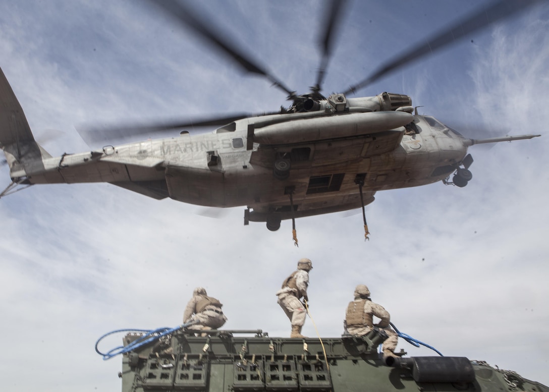 A U.S. Marine Corps CH-53E Super Stallion assigned to Marine Aviation Weapons and Tactics Squadron One lifts a Humvee during a CH-53 tactics exercise at Auxiliary Airfield 2, Yuma, Ariz., April 7, 2017. The CH-53 tactics exercise was part of WTI 2-17, a seven week training event, hosted by MAWTS-1 cadre, which emphasizes operational integration of the six functions of Marine Corps aviation in support of a Marine Air Ground Task Force. MAWTS-1 provides standardized advanced tactical training and certification of unit instructor qualifications to support Marine Aviation Training and Readiness and assists in developing and employing aviation weapons and tactics. 