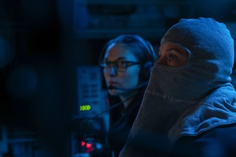 Lt. j.g. Ana Sokolowski uses a console in the combat control room aboard USS William P. Lawrence (DDG 110).