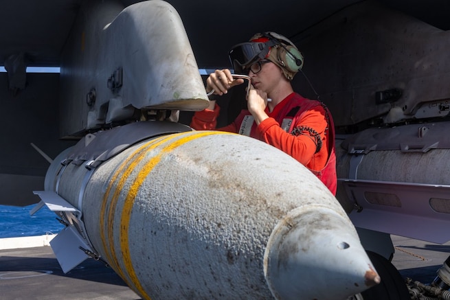 Sailors aboard the USS Harry S. Truman (CVN 75) prepare ordnance for strikes against Houthi targets in Yemen.