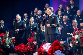 Senior Chief Musician Casey Campbell, from Lubbock, Texas, performs with the U.S. Navy Band during the command's annual holiday concert.