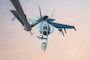 A U.S. Navy F/A-18E Hornet receives fuel from a U.S. Air Force KC-135 Stratotanker over the U.S. Central Command area of responsibility, Oct. 15, 2024. The F/A-18E is deployed to the U.S. 5th Fleet area of operations to help ensure maritime security and stability In the Middle East region. (U.S. Air Force photo)