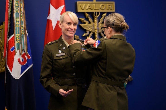 U.S. Army Maj. Gen. Michelle Link, commanding general, 75th U.S. Army Reserve Innovation Command, presents the Basic Aviator Badge with the Astronaut Device to Maj. Kathleen Rubins, a NASA astronaut, during an awards ceremony at the Pentagon, Arlington, Va., Nov. 21, 2024. (U.S. Army photo by Sgt. Daniel Hernandez)