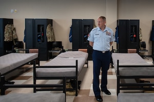 Chief Master Sgt. James Hoy, AFOSI Command Chief, tours the Basic Military Training dormitories at the 320th Training Squadron, Joint Base San Antonio-Lackland, Texas, Nov. 7, 2024. Hoy, a 2002 BMT graduate, visited following a Basic Military Training graduation, marking his first time touring BMT as AFOSI's top enlisted member. (U.S. Air Force photo by Thomas Brading)