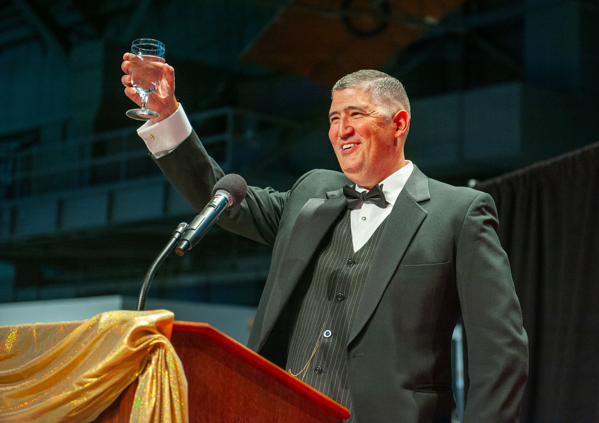 Col. Kenneth Stremmel, National Air and Space Intelligence Center commander, makes a toast during the NASIC Ball, at the National Museum of the U.S. Air Force,Wright-Patterson Air Force Base, Ohio, Nov. 16, 2024. The toast paid homage to NASIC’s 107-year heritage, which began at McCook Army Airfield in Dayton, Ohio.