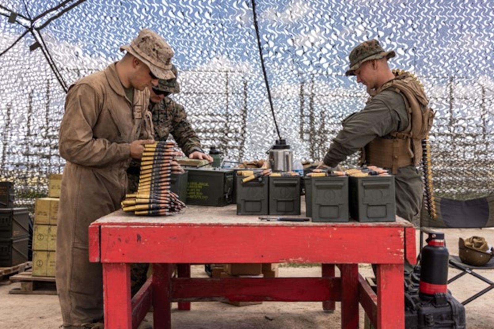 U.S. Marines with Assault Amphibian School prepare ammunition for an amphibious combat vehicle gunnery field exercise at Range 407 at Marine Corps Base Camp Pendleton, California, March 26, 2024. For the gunnery field exercise, AAS students learned to fire the MK19 40 mm automatic grenade launcher and the M2A1 .50-caliber machine gun utilizing the common remotely operated weapons systems. The Marine Corps is taking a deliberate approach to fielding the ACV to the Fleet Marine Force to ensure our Marines understand the platform’s capabilities and can operate it safely and proficiently.