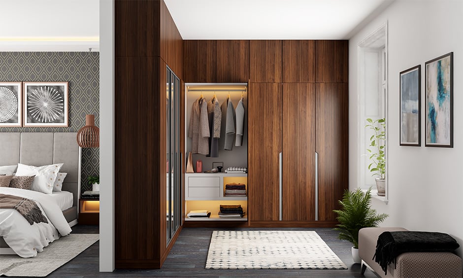 Walk-in wardrobe with dimensions in feet, showcasing a luxurious and stylish design.