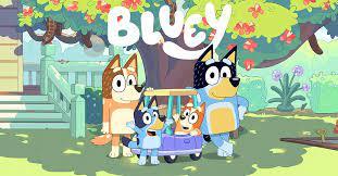 The 'Bluey' characters standing in their backyard on the show