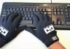 Gamer Gloves being used on a keyboard.