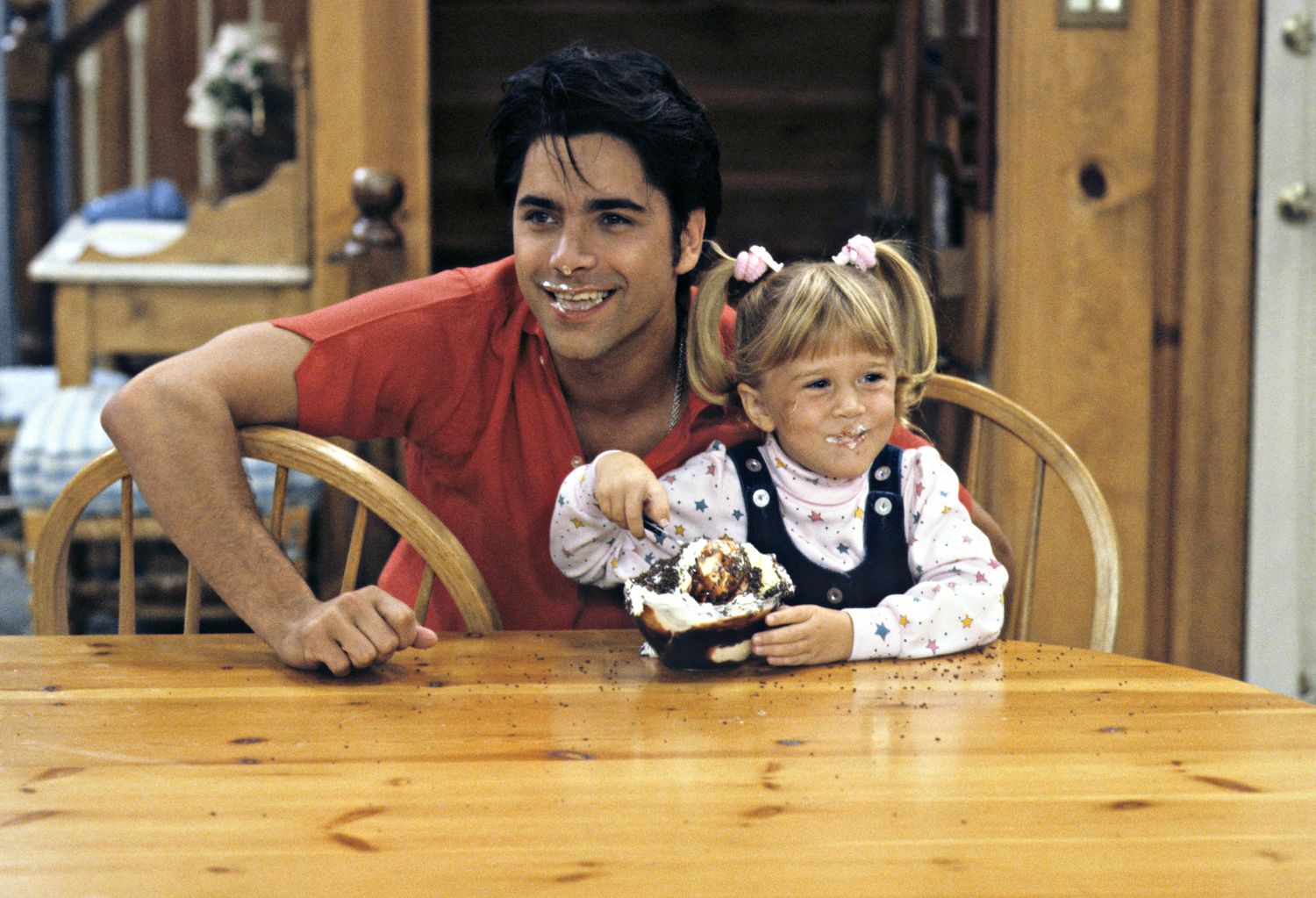 Image may contain John Stamos Wood Human Person Hardwood Flooring Icing Food Cake Dessert Creme and Cream