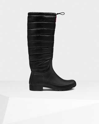 Image may contain Clothing Apparel Riding Boot Footwear Boot Shoe and High Heel