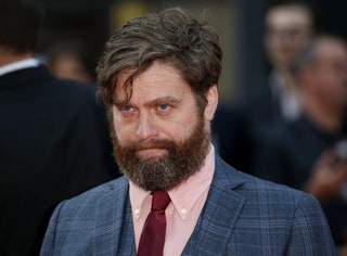 Image may contain Zach Galifianakis Face Human Person Tie Accessories Accessory Beard Coat Suit and Clothing