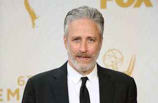 Image may contain Jon Stewart Tie Accessories Accessory Suit Coat Clothing Overcoat Apparel Human Person and Face