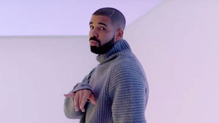 This image may contain Clothing Apparel Drake Human Person Man Face and Sweater