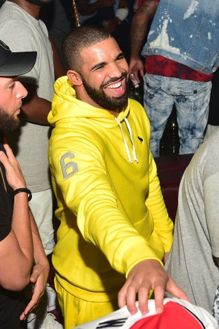 This image may contain Drake Clothing Apparel Human Person Face Beard and Pants