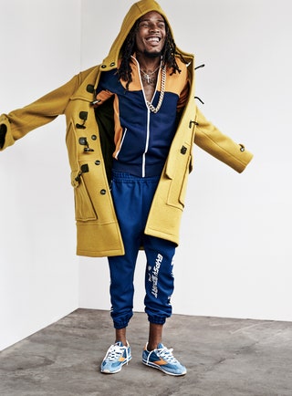 This image may contain Clothing Apparel Footwear Shoe Coat Fetty Wap Raincoat Human Person and Overcoat